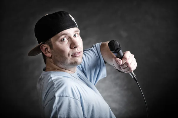 Rap singer holding microphone — Stock Photo, Image