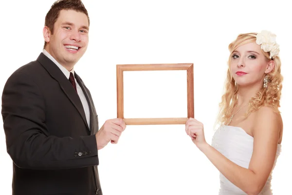 Wedding couple with empty frame Stock Photo