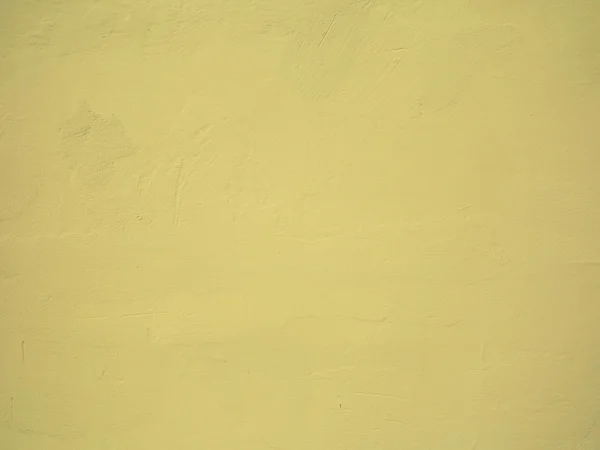 Parede de concreto pintado amarelo — Fotografia de Stock