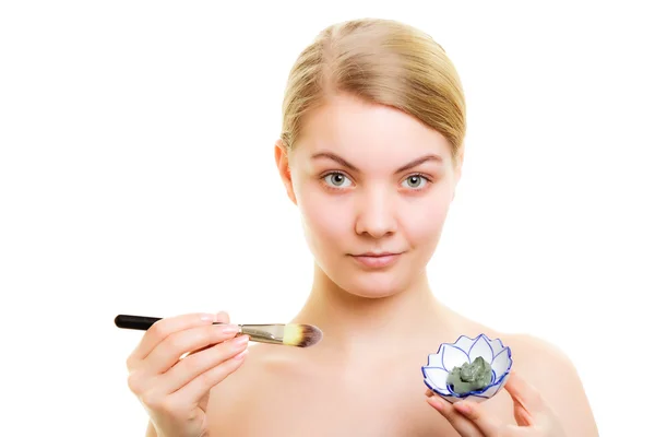 Woman applying clay mud mask — Stock Photo, Image