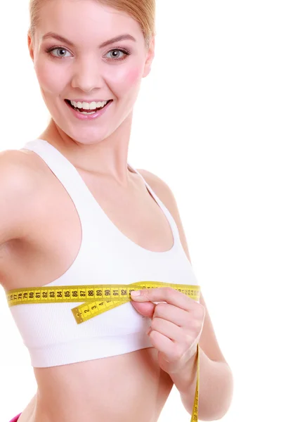 Woman measuring her bust with measure tape — Stock Photo, Image