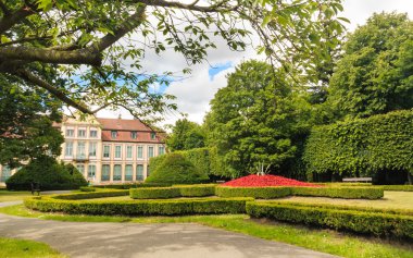 view on abbots palace and flowers in gdansk oliva park. clipart