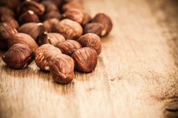 Hazelnuts on  old wooden table — Stock Photo, Image