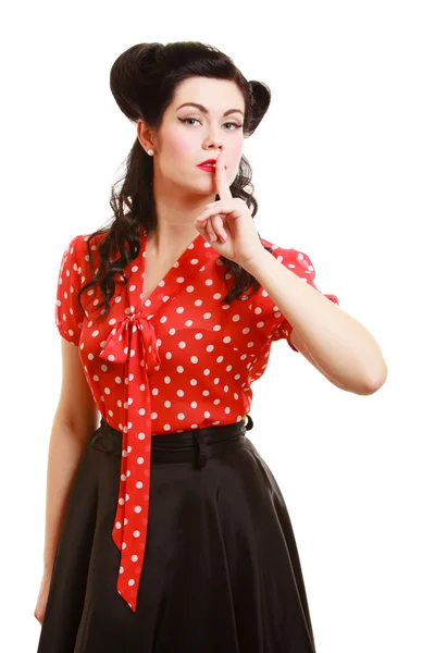 Pin-up girl with finger on lips — Stock Photo, Image