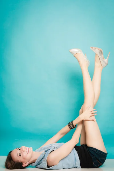 Woman lying with her legs raised up — Stock Photo, Image