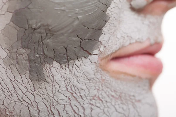 Woman applying clay mask on face. — Stock Photo, Image