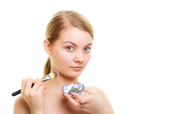 Woman applying clay mud mask — Stock Photo, Image