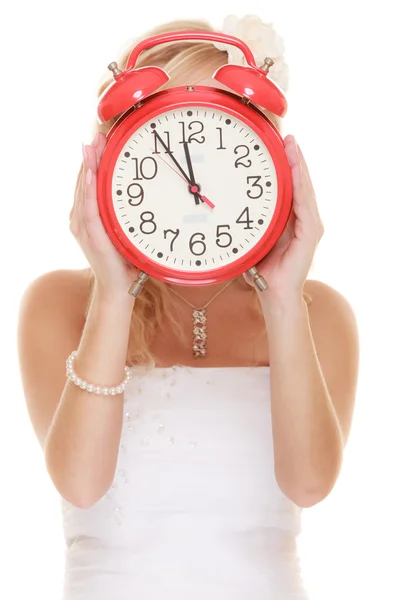 Bride holding alarm clock. — Stock Photo, Image