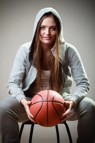 Sporty girl holding ball — Stock Photo, Image