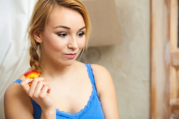 Candid portrait pensive woman teenage girl eating apple fruit — Stock Photo, Image