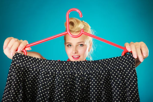 Pinup girl  holding black skirt. — Stock Photo, Image