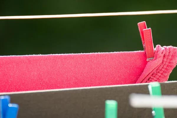 Clean laundry hanging to dry — Stock Photo, Image