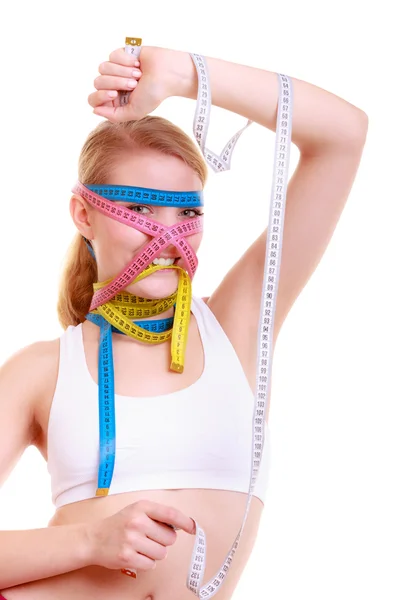 Obsesję na punkcie fitness kobieta z dużą ilością środka kolorowe taśmy — Zdjęcie stockowe