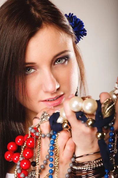 Summer girl with plenty of jewellery, beads in hands — Stock Photo, Image