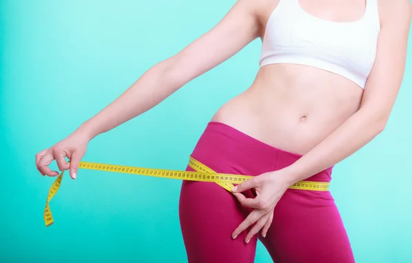 Woman  measuring her loins — Stock Photo, Image