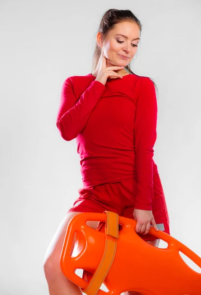 Girl lifeguard holding equipment — Stock Photo, Image