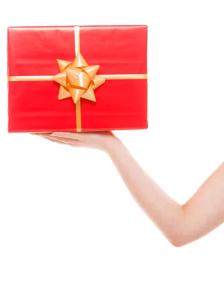 Woman holding big red gift box — Stock Photo, Image