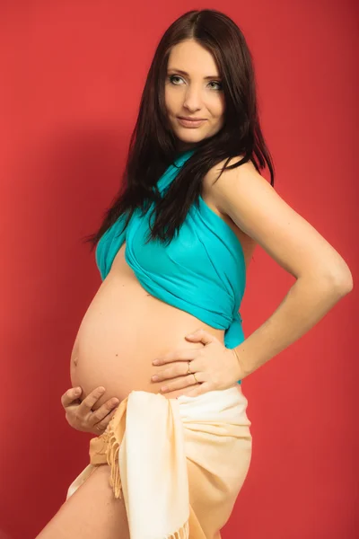 Woman touching her belly — Stock Photo, Image