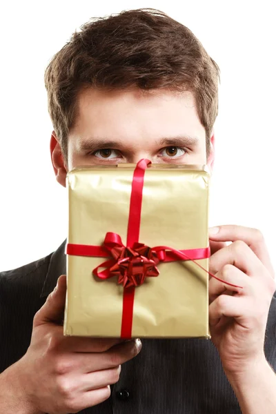 Man giving golden gift box Stock Picture