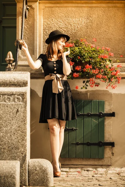 Retro style fashion woman in old town — Stock Photo, Image