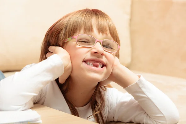 Child sticking tongue at home — Stock Photo, Image