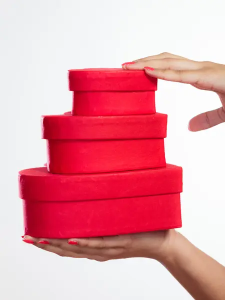 Woman holding gift boxes — Stock Photo, Image