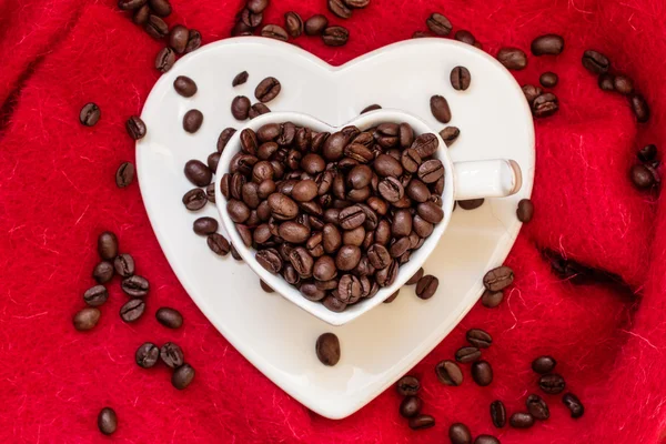 Cup with coffee beans — Stock Photo, Image