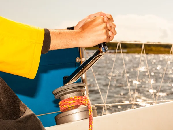 Hand on winch capstan — Stock Photo, Image