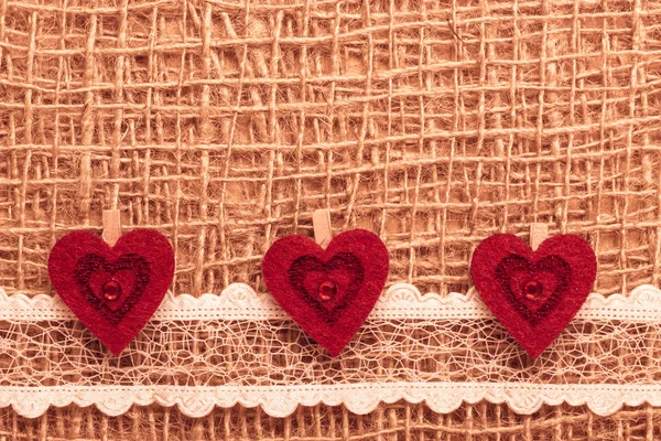 Red hearts on  cloth — Stock Photo, Image