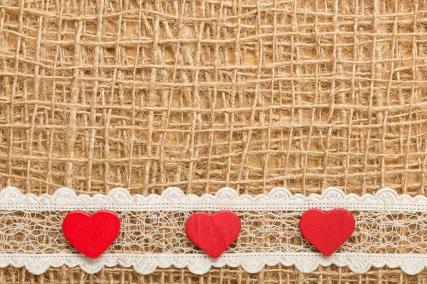 Red hearts on  cloth — Stock Photo, Image