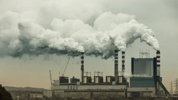 Smoke from chimneys of power plant — Stock Photo, Image