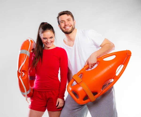 Lifeguard couple with equipment — Stock Photo, Image