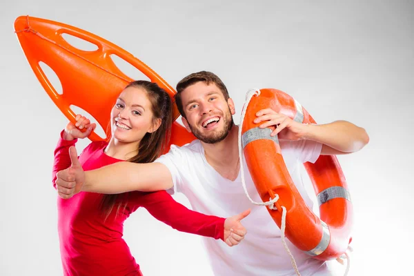 Lifeguard couple with equipment — Stock Photo, Image