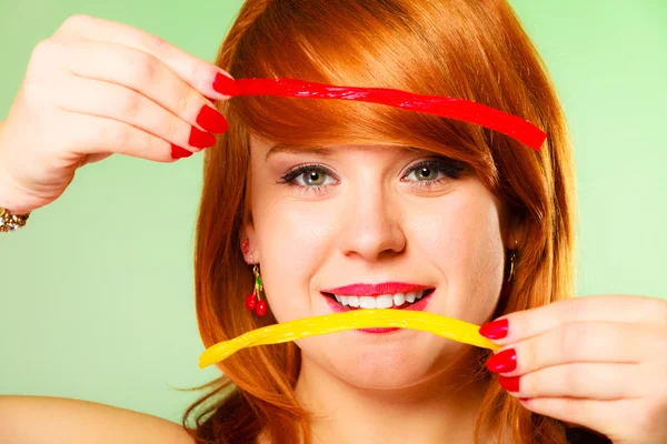 Woman holding candies — Stock Photo, Image