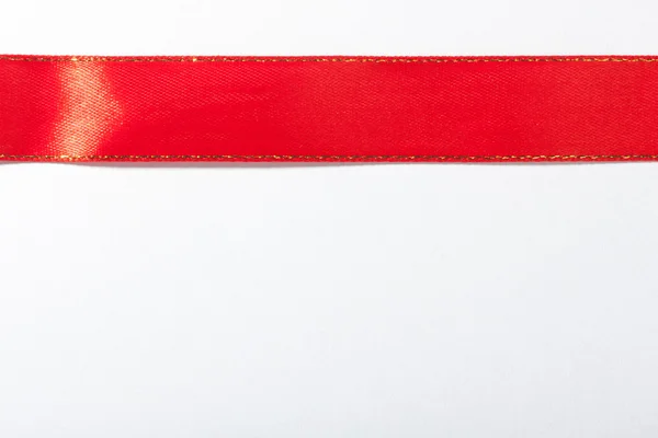 Lesklou červenou stužku — Stock fotografie