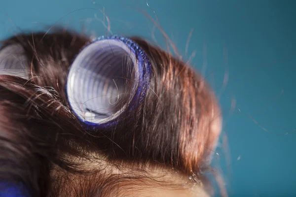 Girl with hair curlers — Stock Photo, Image