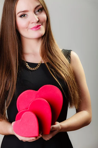 Woman holding red  boxes — Stock Photo, Image