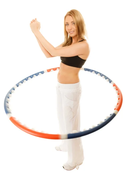 Girl doing exercise with hula hoop. — Stock Photo, Image