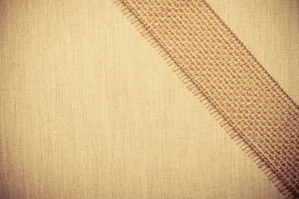 Jute ribbon on linen cloth — Stock Photo, Image