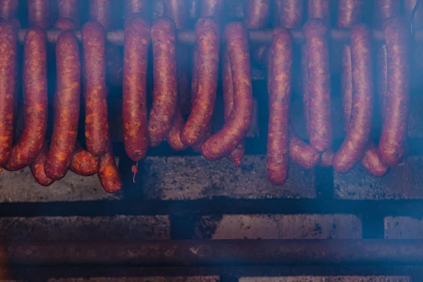 Smoked sausuages in smokehouse. — Stock Photo, Image