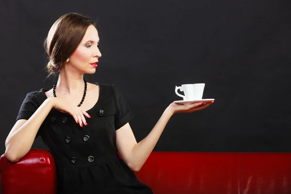 Woman holds tea cup — Stock Photo, Image