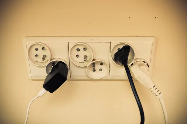 Dirty electric plug in socket for power. — Stock Photo, Image