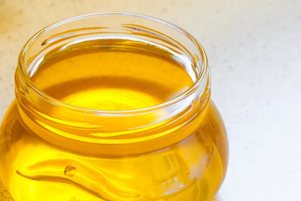 Jar of organic floral honey — Stock Photo, Image