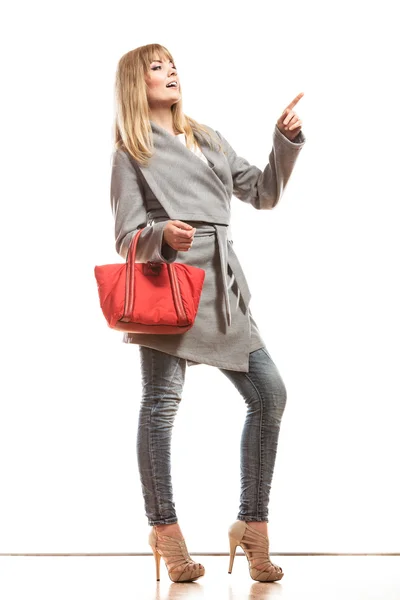 Woman in gray coat pointing — Stock Photo, Image