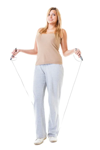 Sporty girl plus size doing exercise with jump rope. — Stock Photo, Image