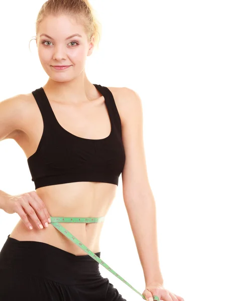 Diet. slim blonde girl with measure tape measuring waist — Stock Photo, Image