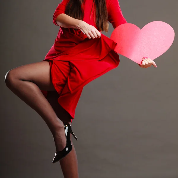 Woman dancing while holds heart — Stock Photo, Image