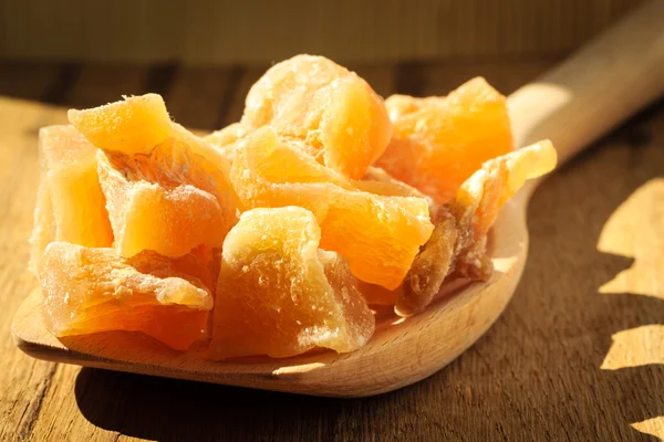 Candied ginger on wooden spoon — Stock Photo, Image