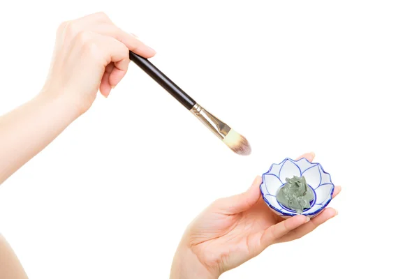 Woman with brush applying mask — Stock Photo, Image