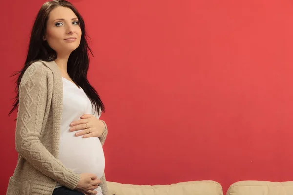 Mulher tocando sua barriga — Fotografia de Stock